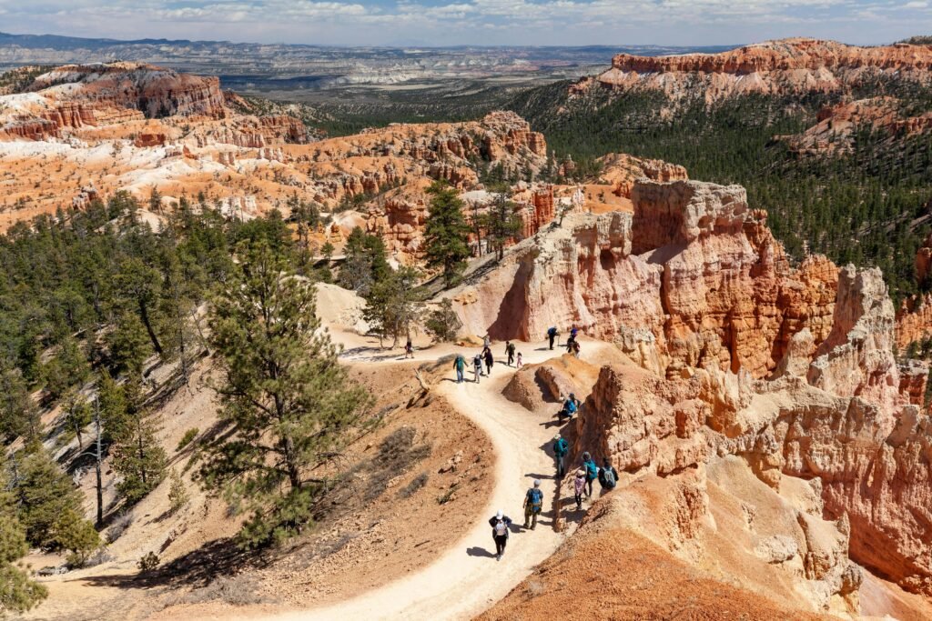 A breathtaking view of hikers exploring a trail in Bryce Canyon, Utah, USA.